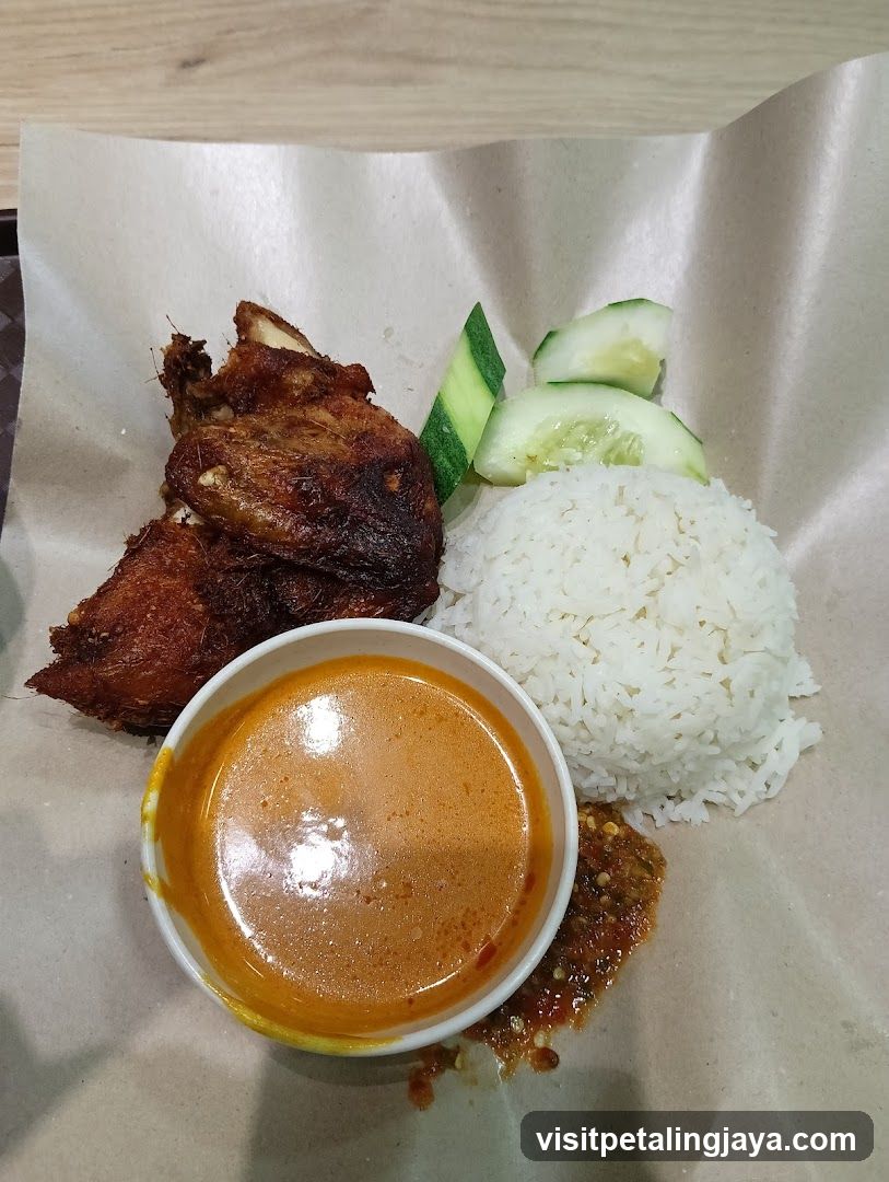 Fried Chicken Meal with Rice and Cucumber