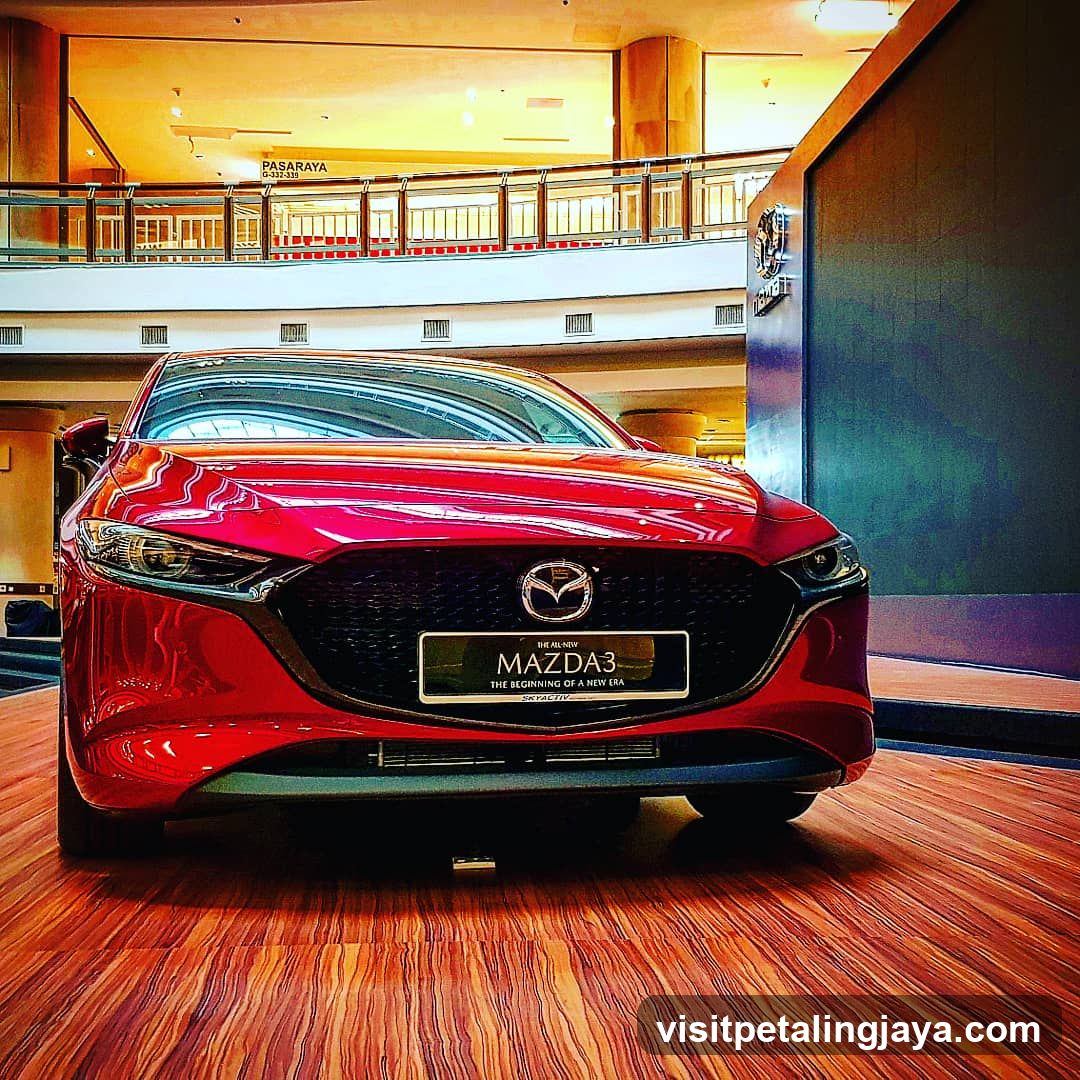 Red Mazda3 on display