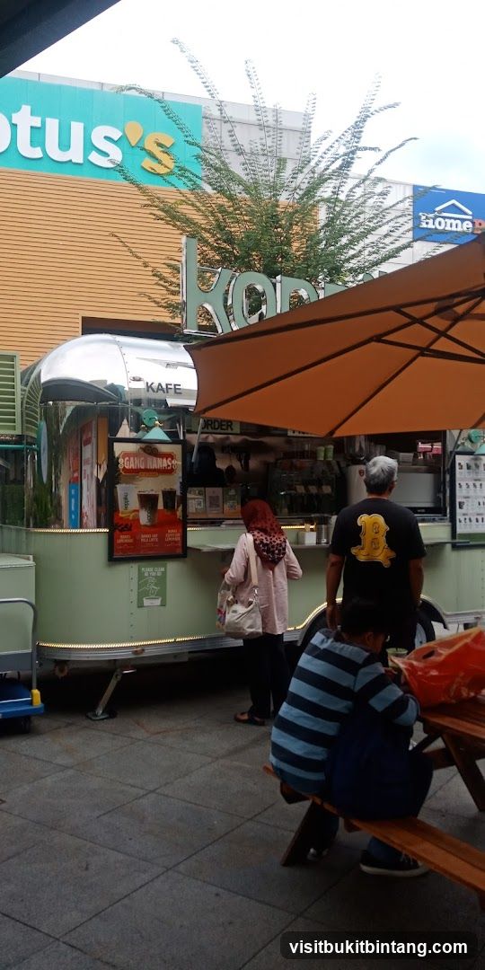 Outdoor cafe with a retro Airstream trailer