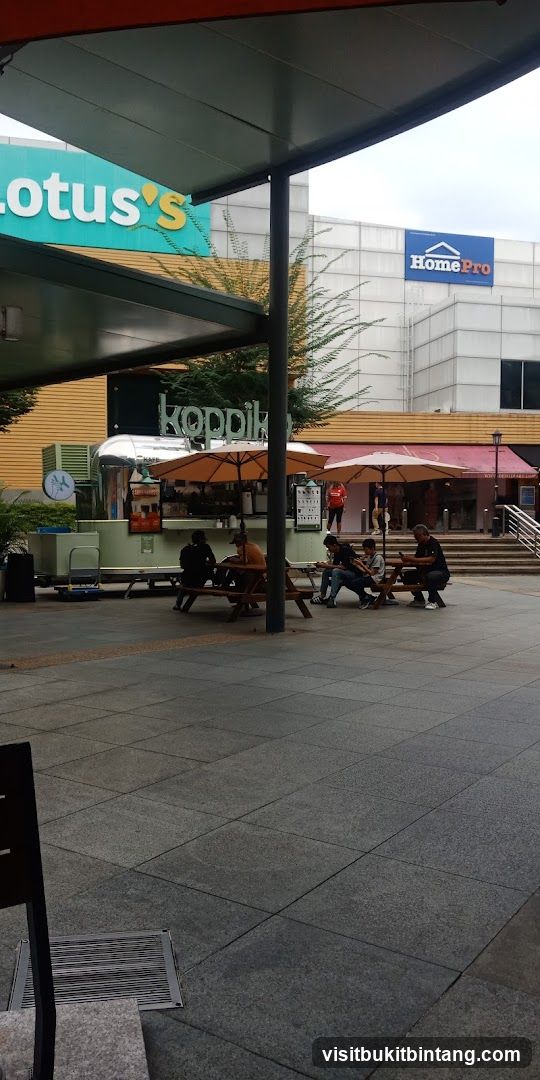 Outdoor seating area with food stall