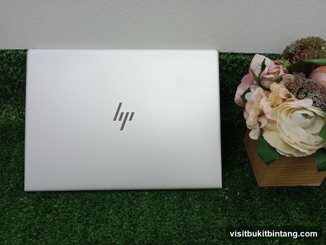 HP Laptop with Floral Arrangement
