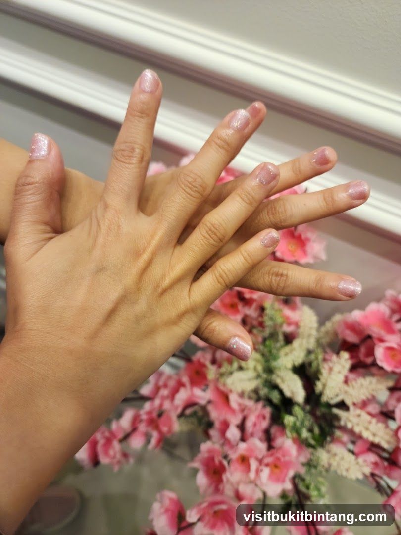 Manicured Hands with Pink Flowers