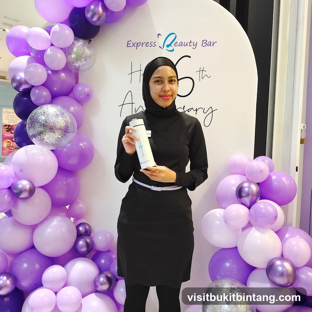 Woman holding a branded water bottle at an event
