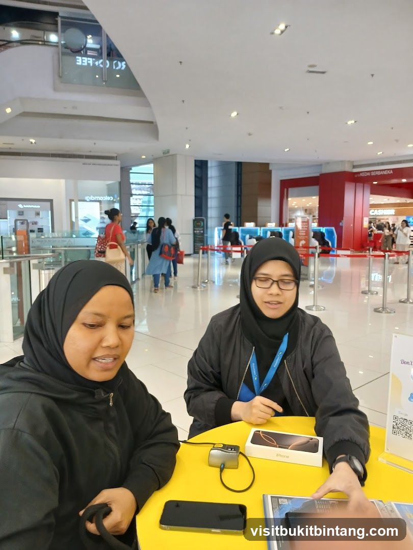 Two women at a table with phones