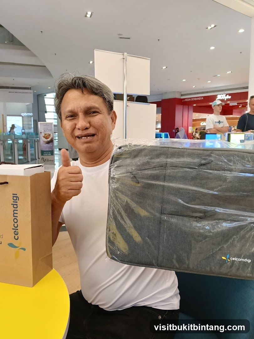 Man with Celcom Diggi Bag and Laptop Sleeve