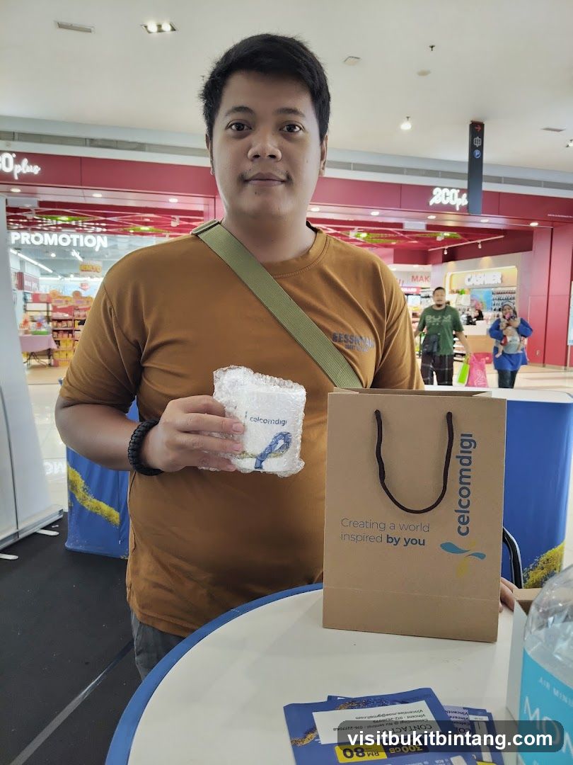 Man holding promotional item