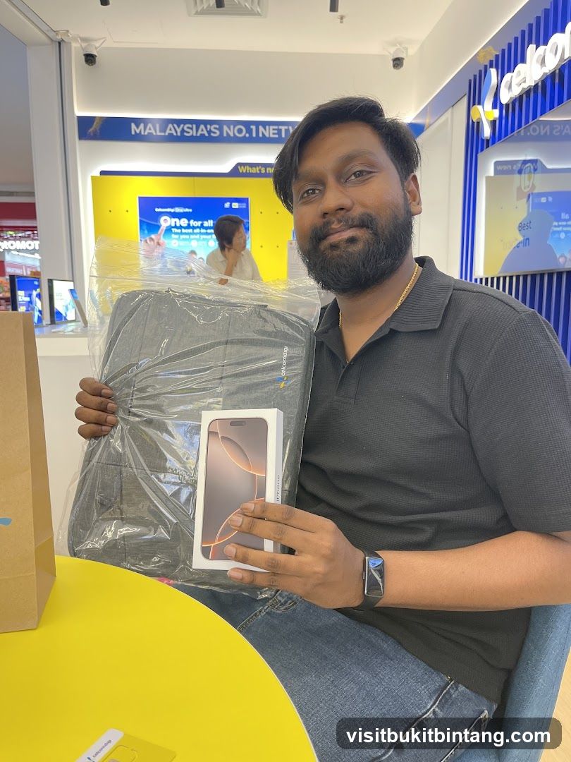 Man holding a new iPhone and a bag