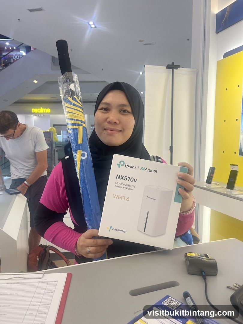 Woman holding a router box and an umbrella