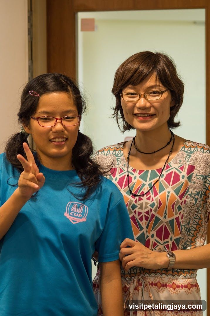 Two women posing indoors
