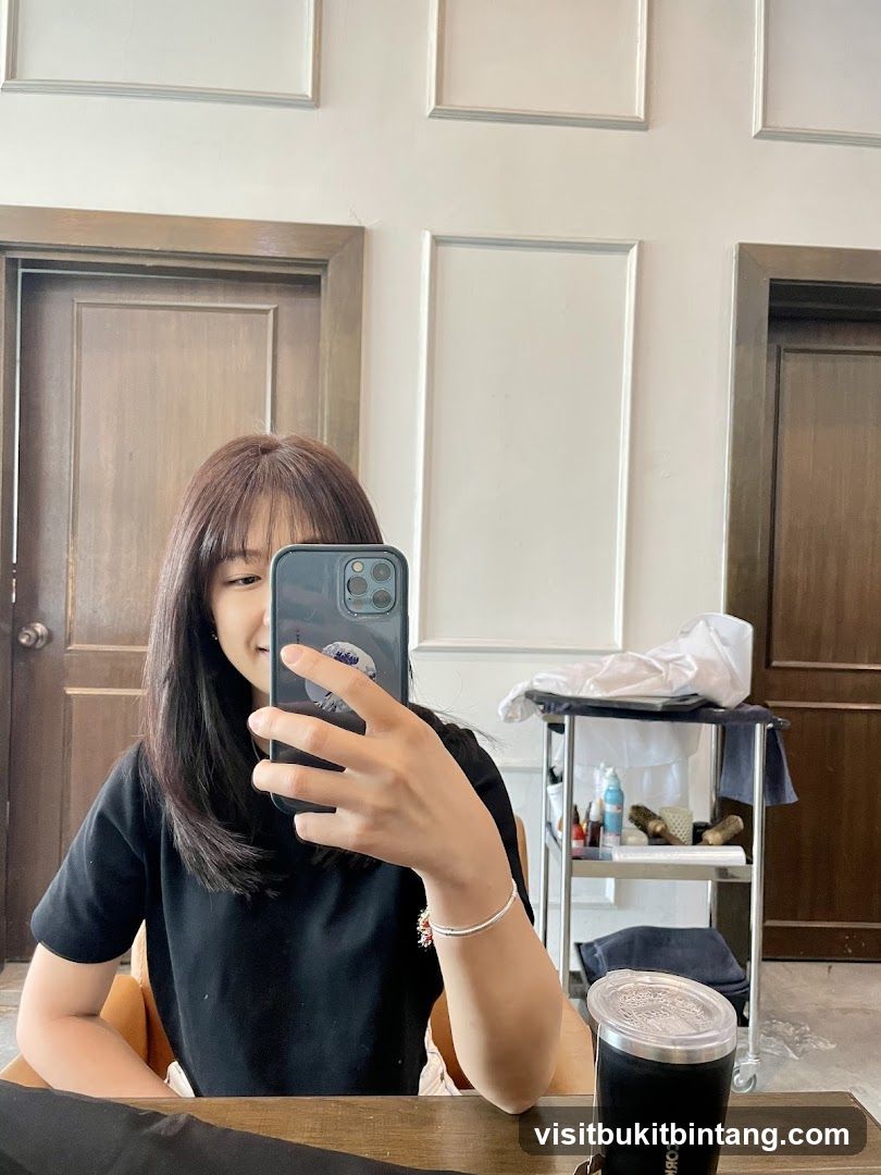 Woman taking a selfie in a salon