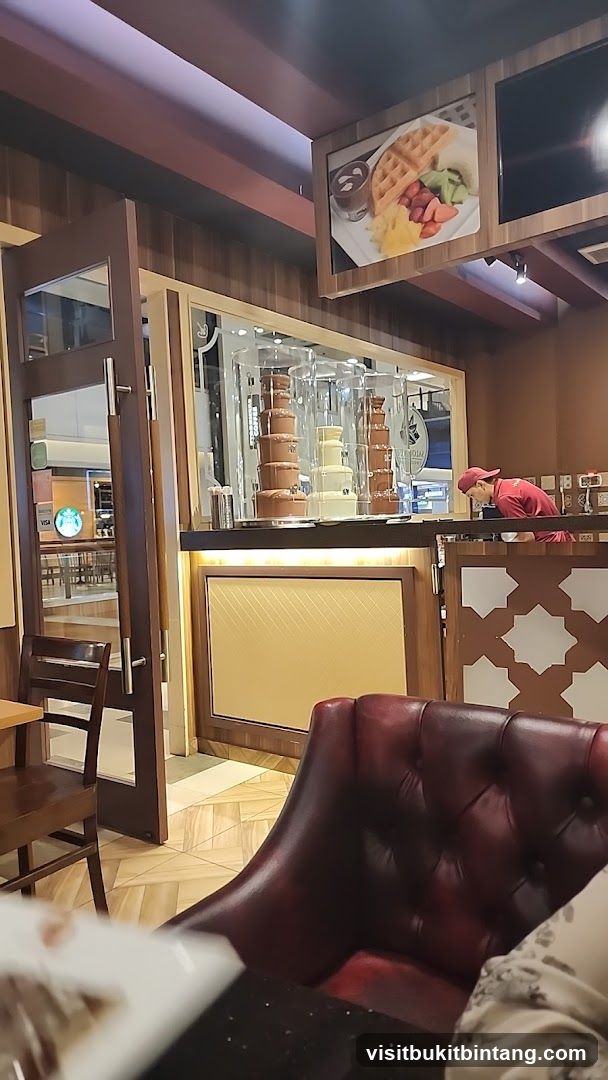 Dessert shop interior with chocolate fountains