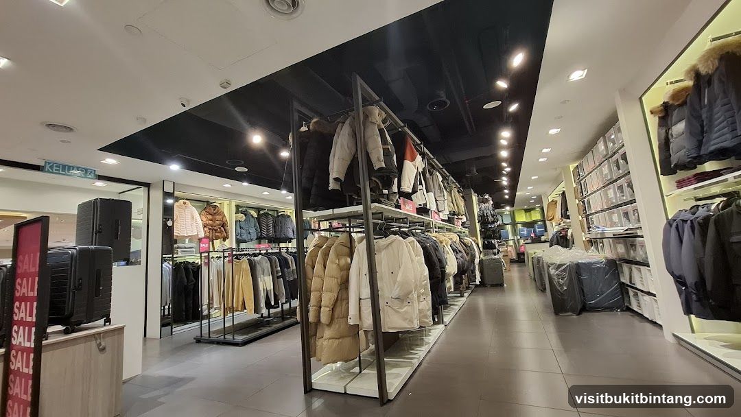 Clothing store interior with winter wear and luggage