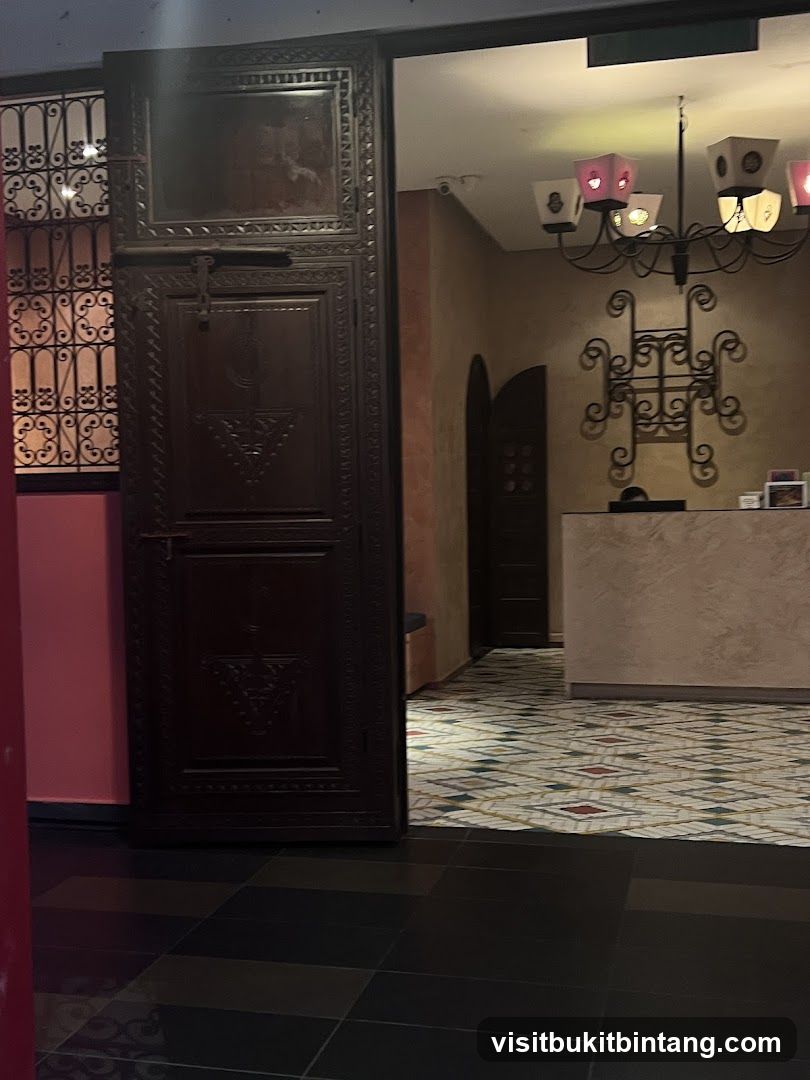 Interior of a building with ornate doors and a reception desk