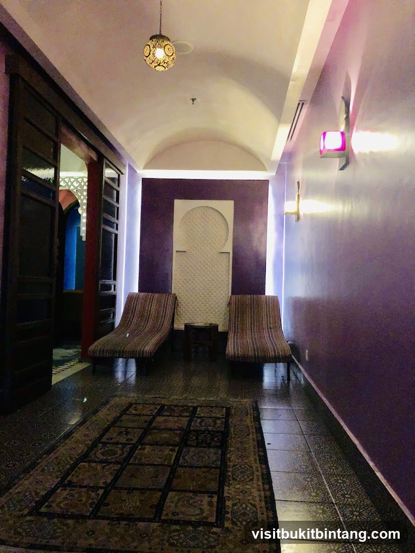 Moroccan-style hallway with lounge chairs