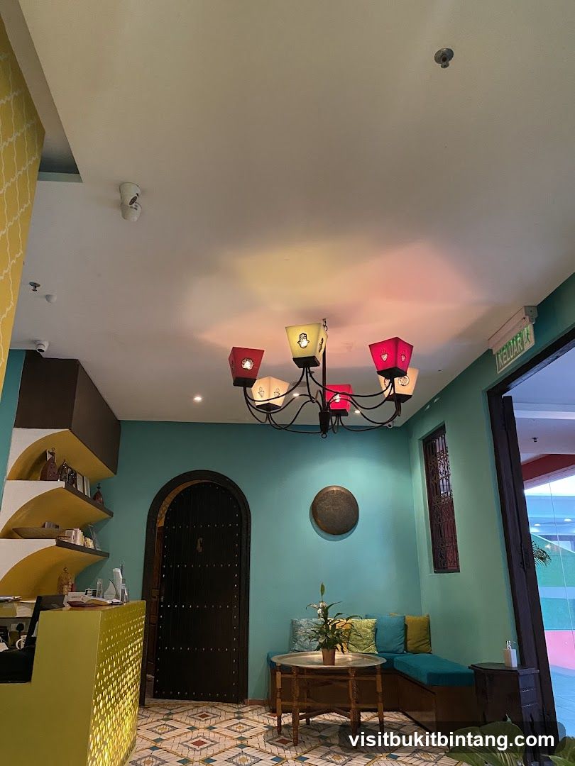 Interior of a room with a teal wall and a yellow counter