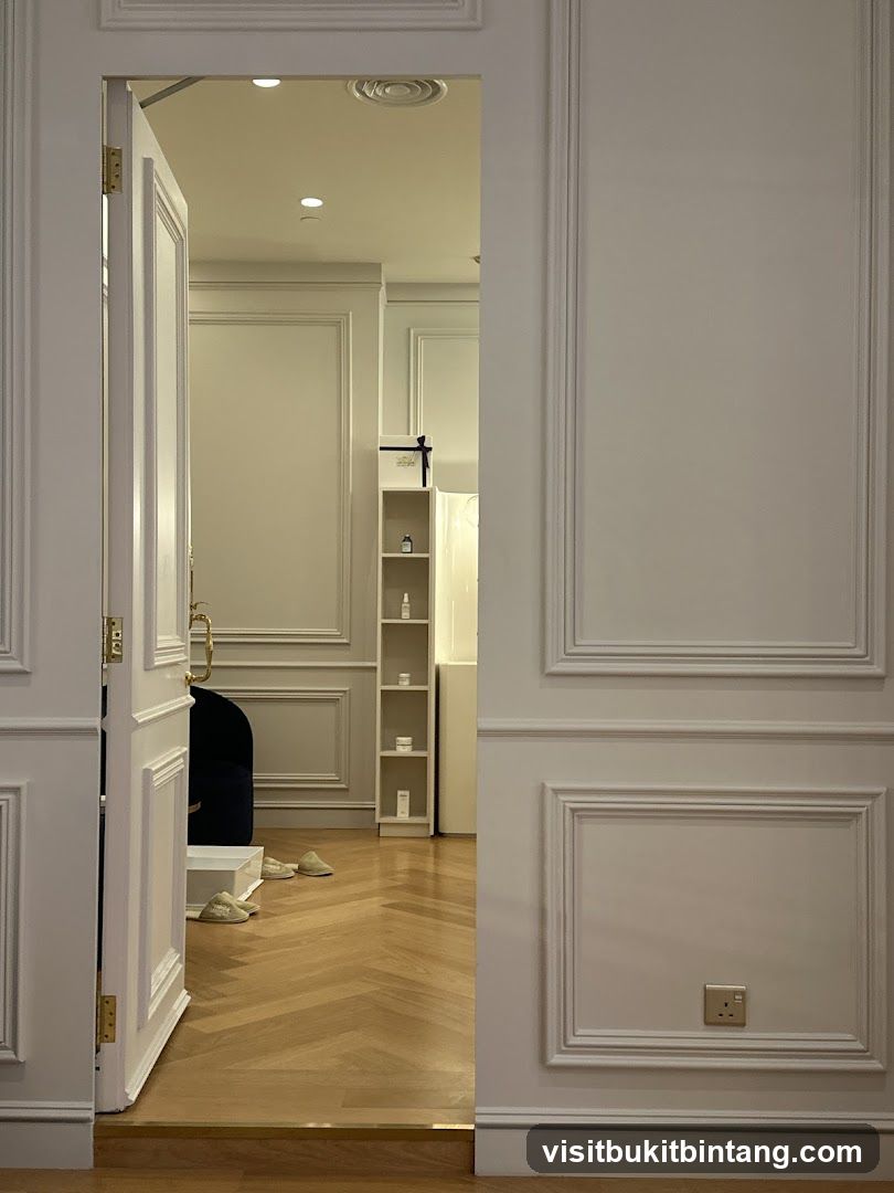Interior of a room with white paneling and a doorway