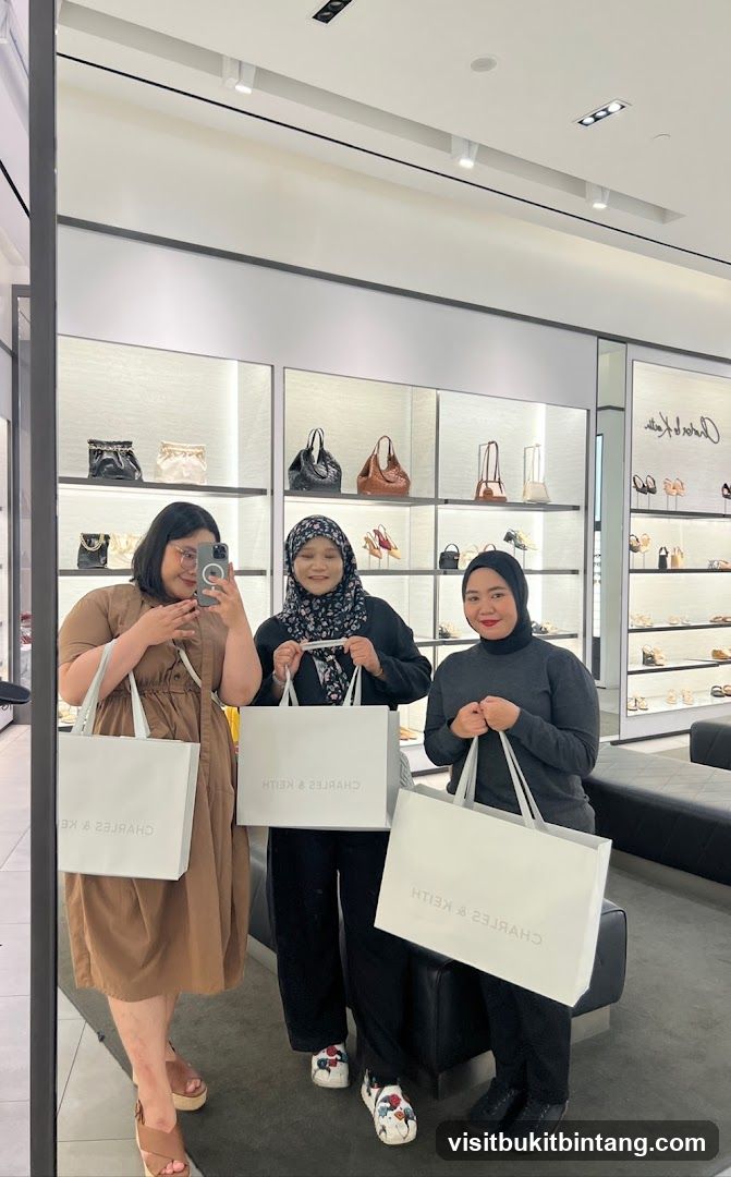 Three women holding shopping bags