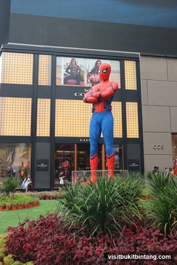 Giant Spiderman Statue in front of Coach and COS stores