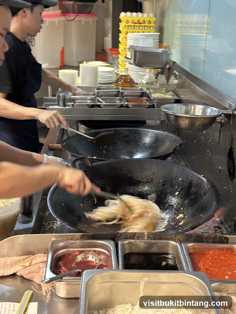 Chefs cooking in a busy kitchen