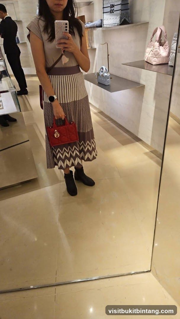 Woman holding a red handbag in a store