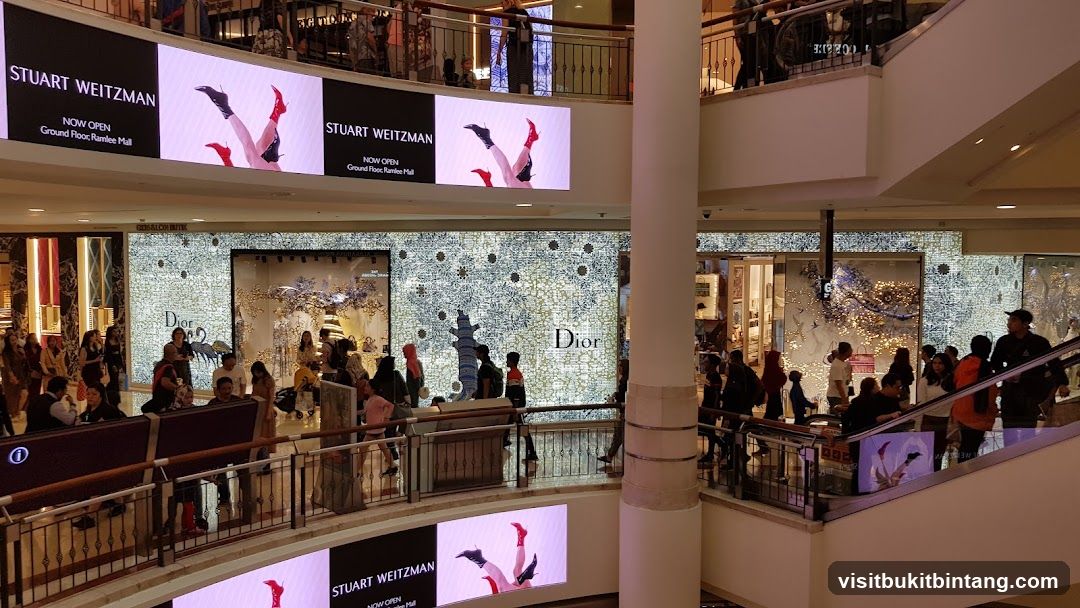 Mall Interior with Storefronts and Digital Displays
