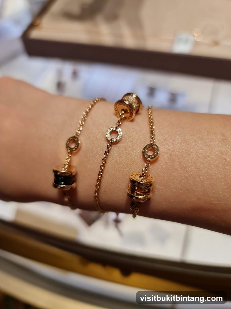 Gold bracelets with cylindrical charms