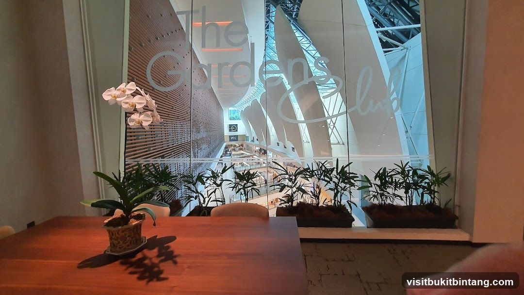 Interior view of a dining area overlooking a shopping mall