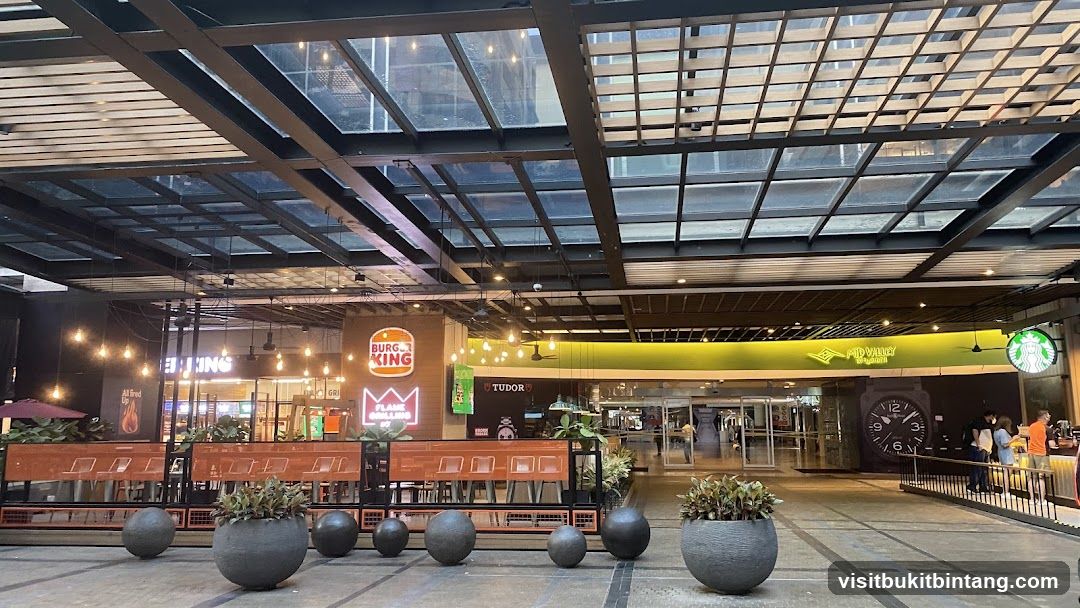 Outdoor dining area with Burger King and Starbucks