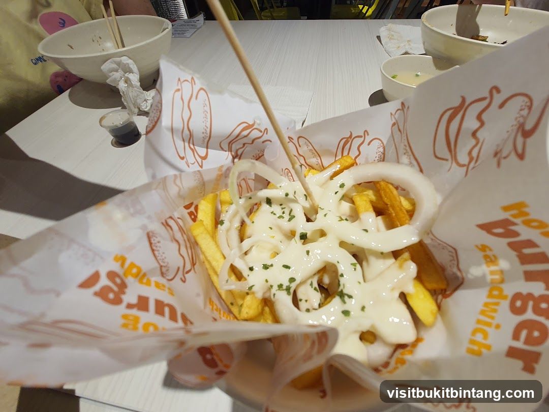 Fries with Onion Rings and Sauce