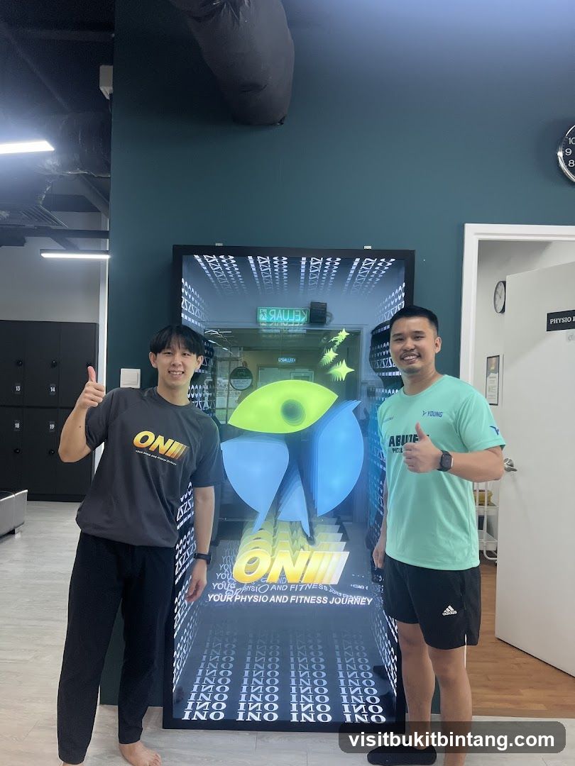 Two men posing in front of a digital display