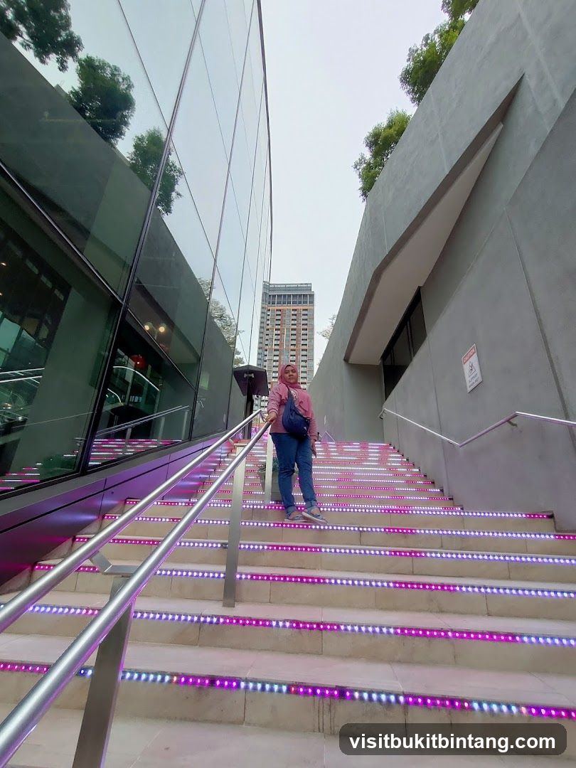 Woman on illuminated stairs
