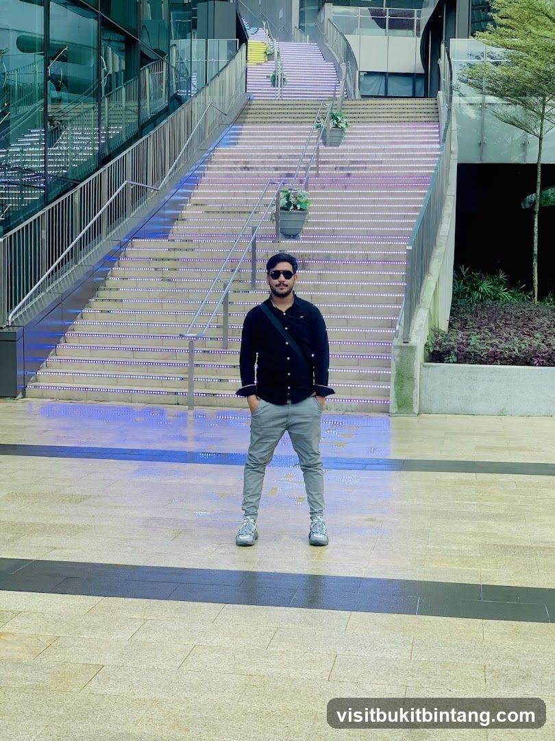 Man Posing on Illuminated Stairs