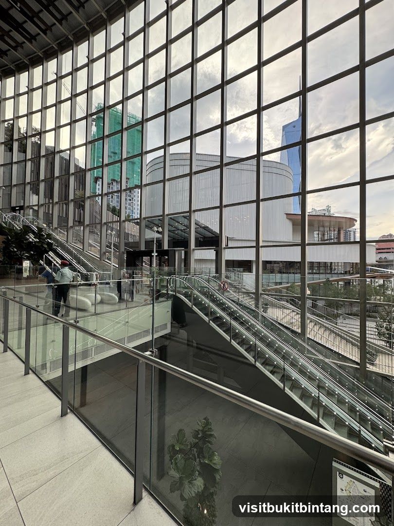 Modern Interior with Escalators and City View