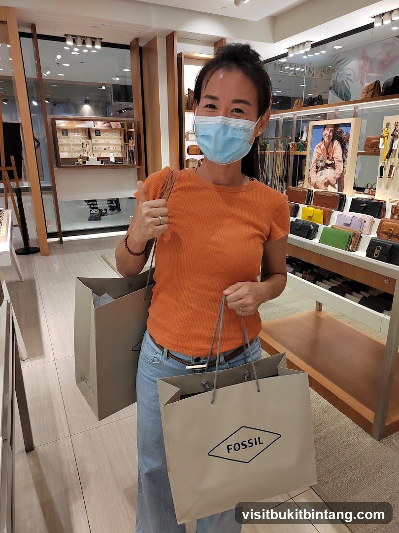 Woman with Fossil Shopping Bags