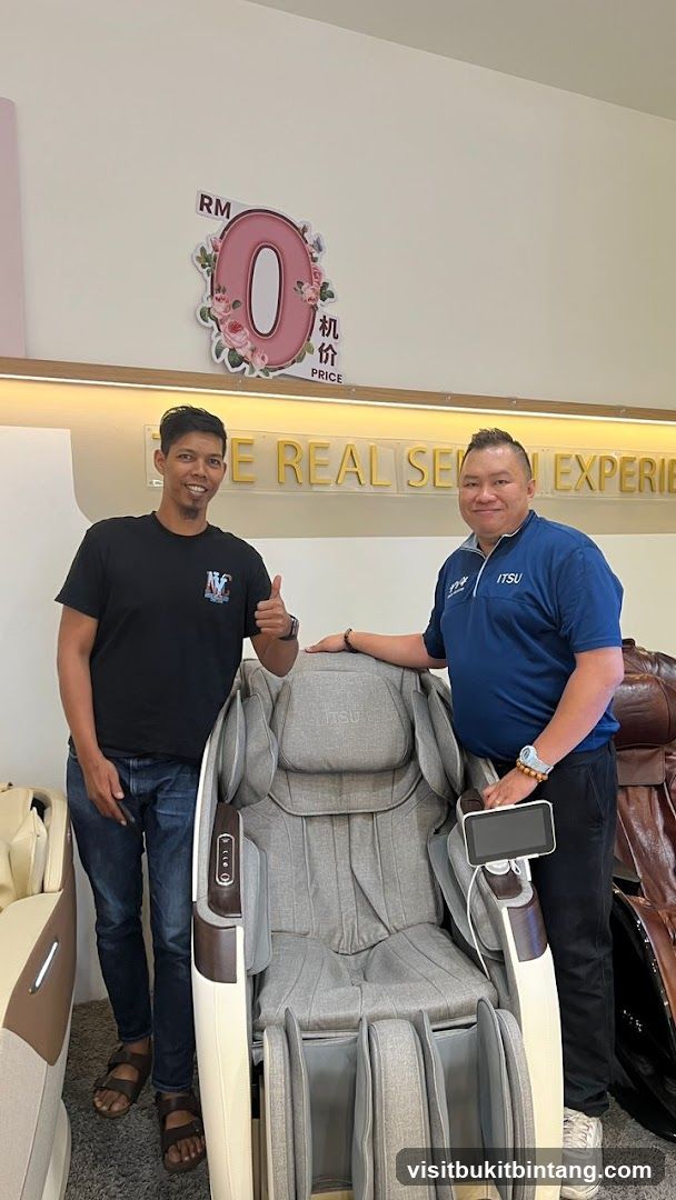 Two men with a massage chair