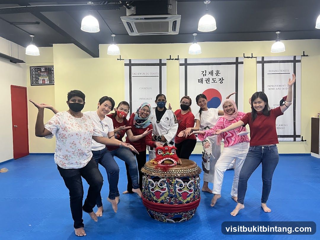 Group Posing with Taekwondo Banner and Drum