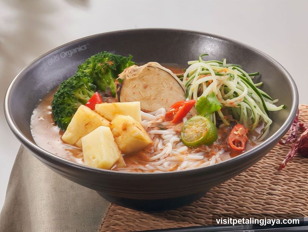 Bowl of Noodle Soup with Broccoli and Pineapple