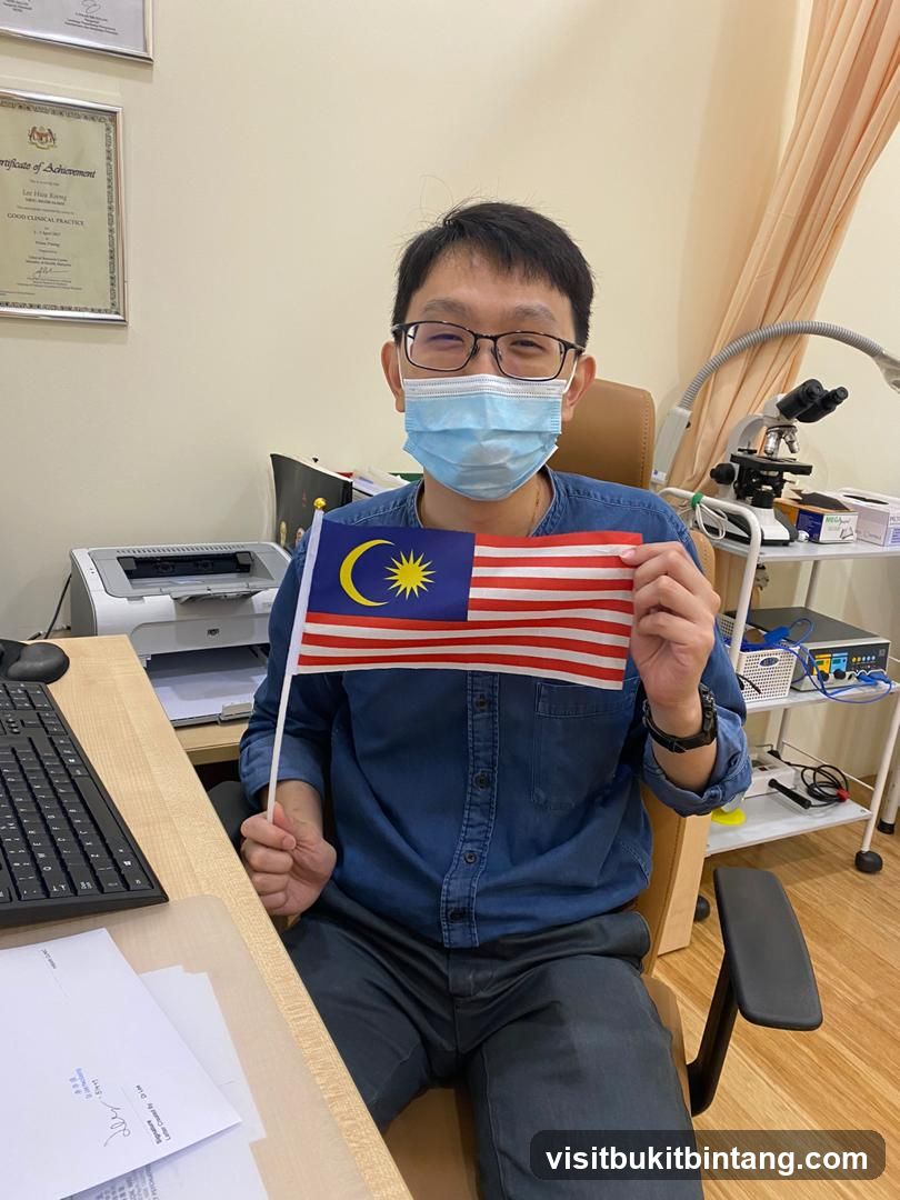 Man holding Malaysian flag