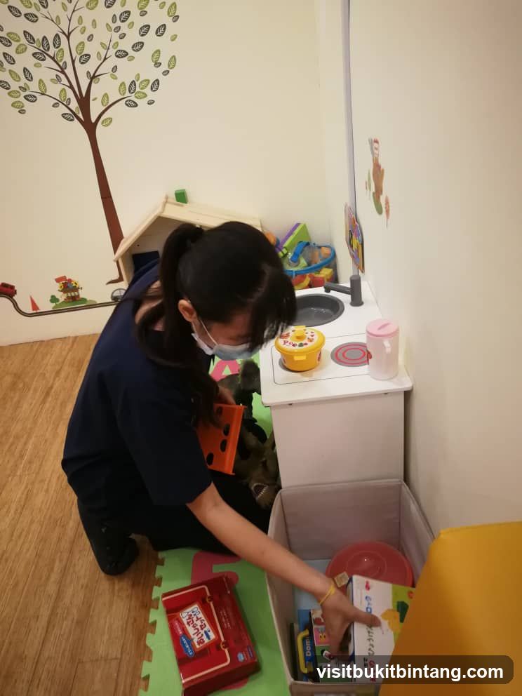 Woman tidying up toys