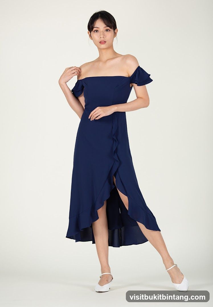 Woman in a navy blue off-the-shoulder dress