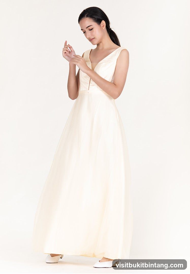 Woman in a cream-colored gown