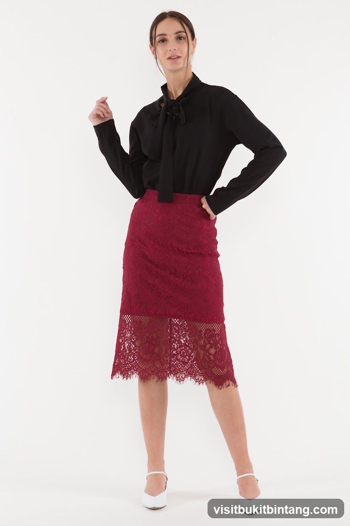 Woman in Black Blouse and Burgundy Lace Skirt
