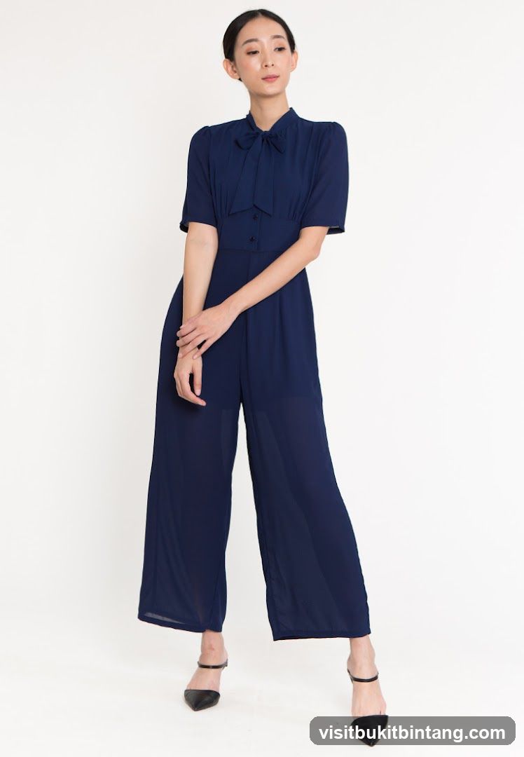 Woman in Navy Jumpsuit