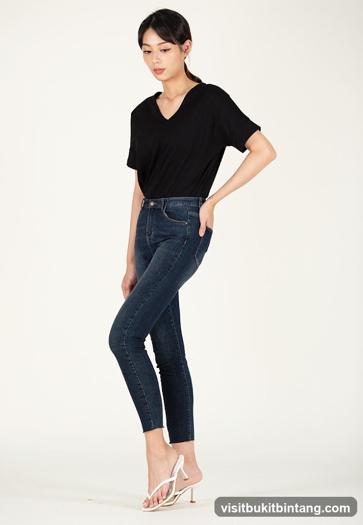 Woman in Black Top and Jeans