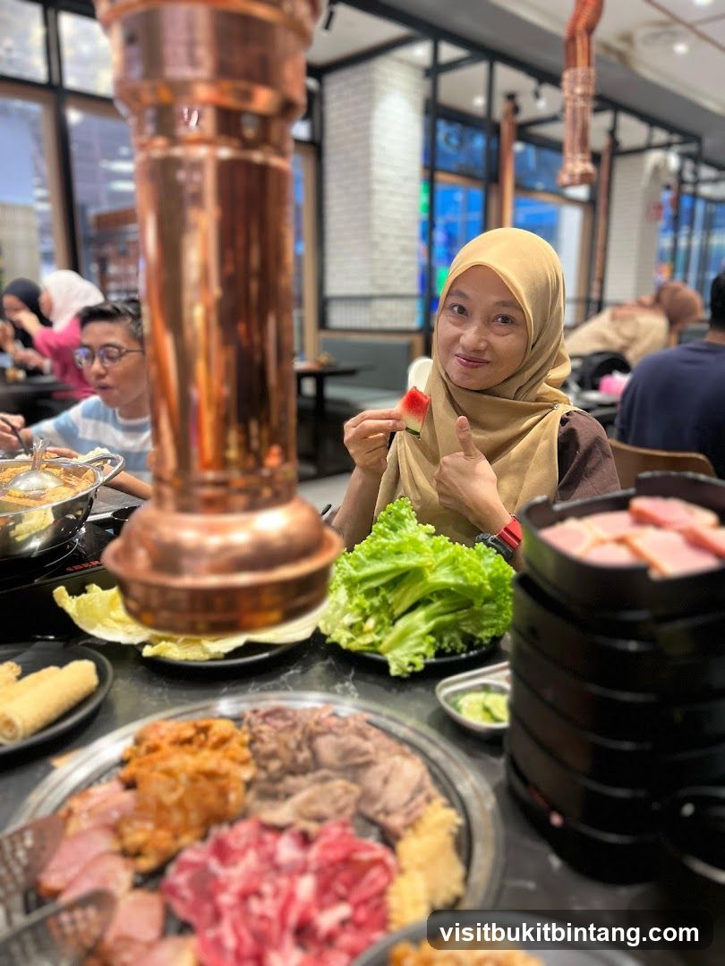 People enjoying a meal at a Korean BBQ restaurant