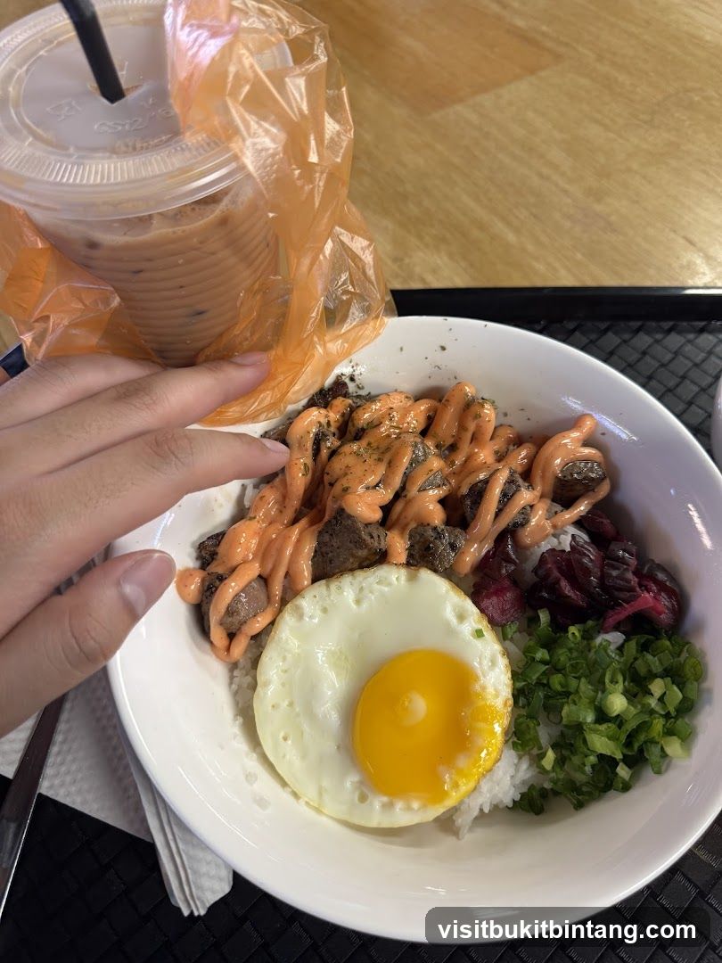 Beef Rice Bowl with Fried Egg and Drink