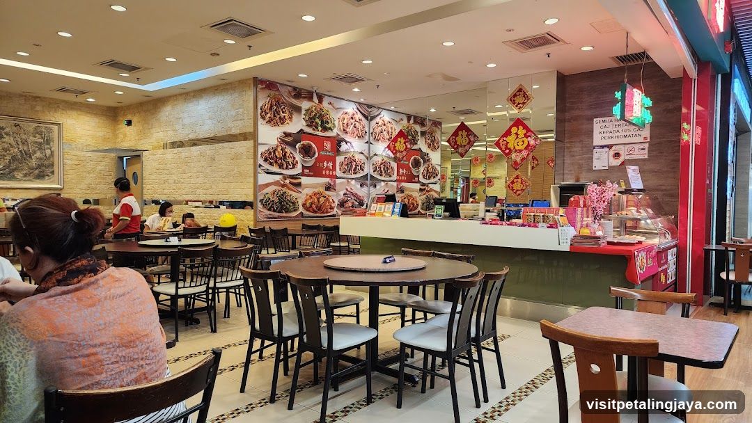 Restaurant Interior with Menu Board and Staff