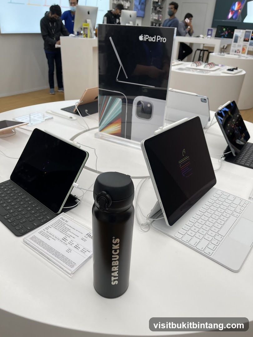 Apple Store Display with Starbucks Tumbler