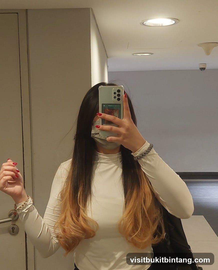 Woman taking a mirror selfie