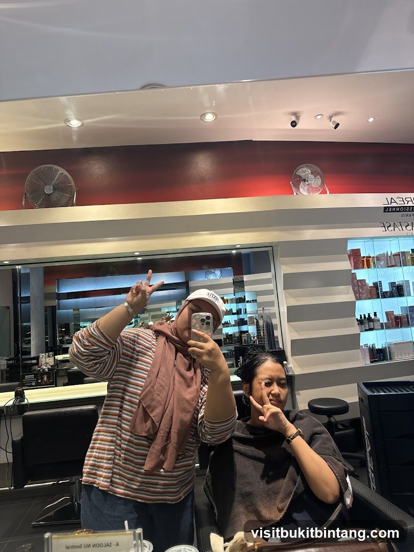 Two Women Taking a Mirror Selfie in a Salon